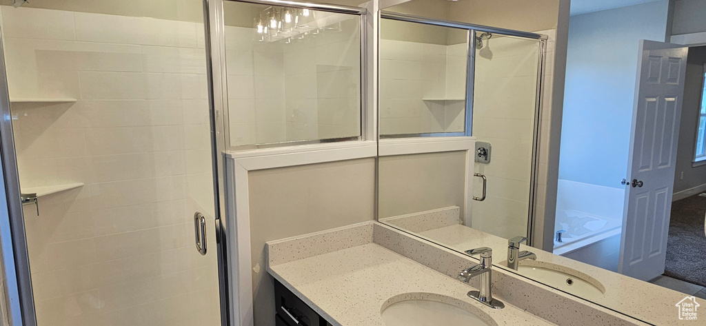 Bathroom with vanity and an enclosed shower