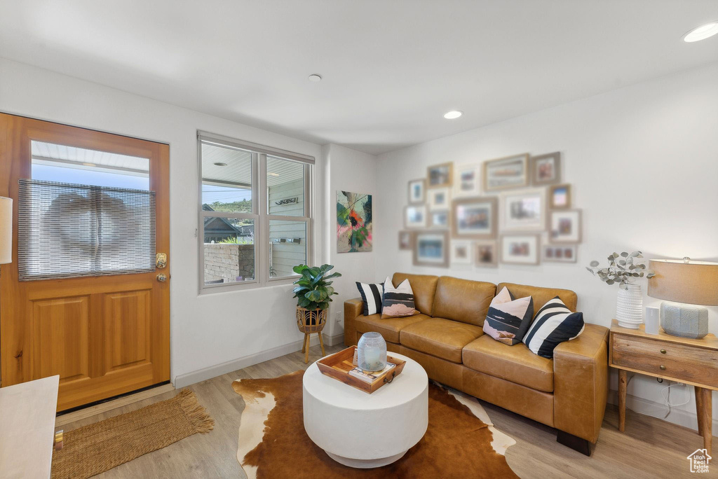 Living room with light wood-type flooring