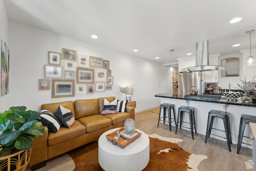 Living room with light wood-type flooring