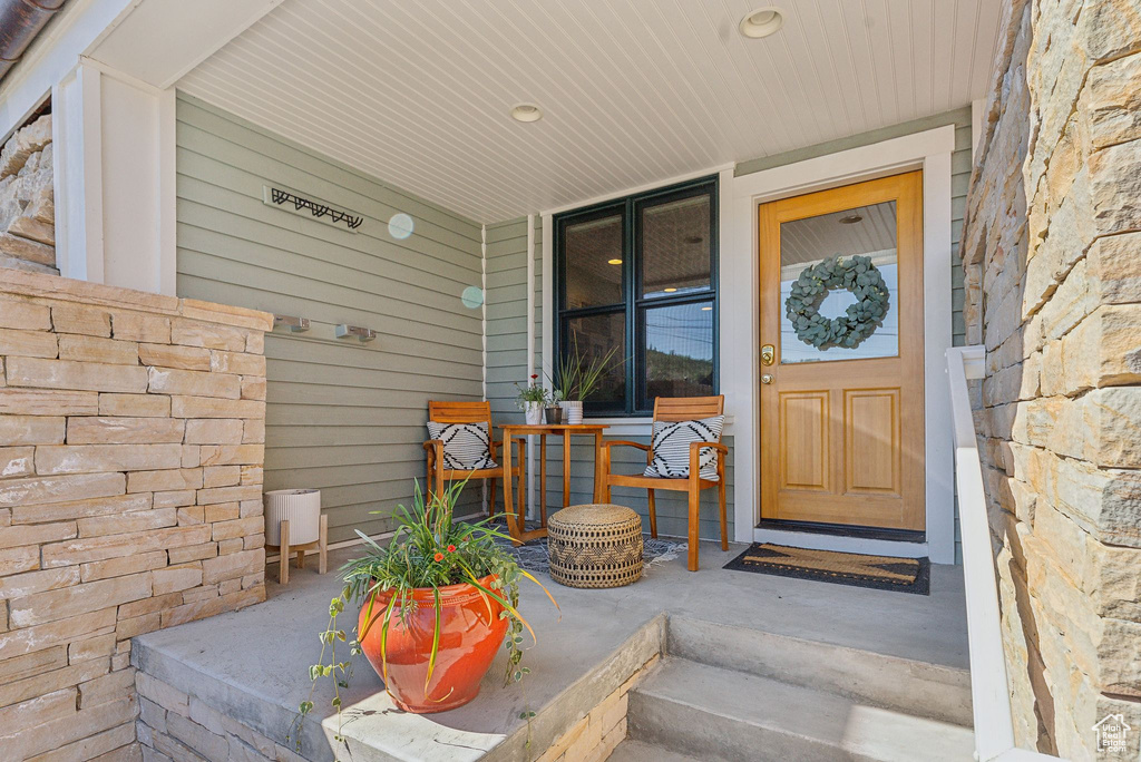 Entrance to property featuring a porch