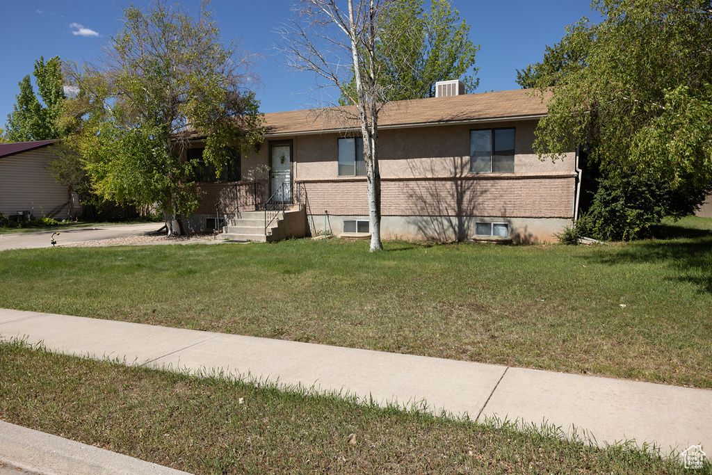 View of front of home featuring a front lawn