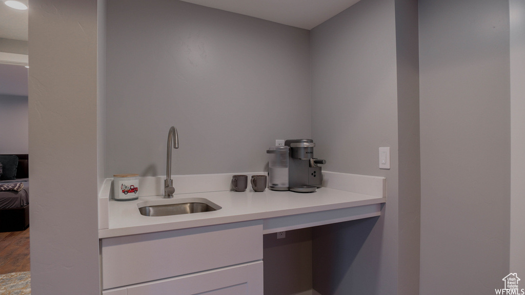 Bathroom with sink and hardwood / wood-style flooring