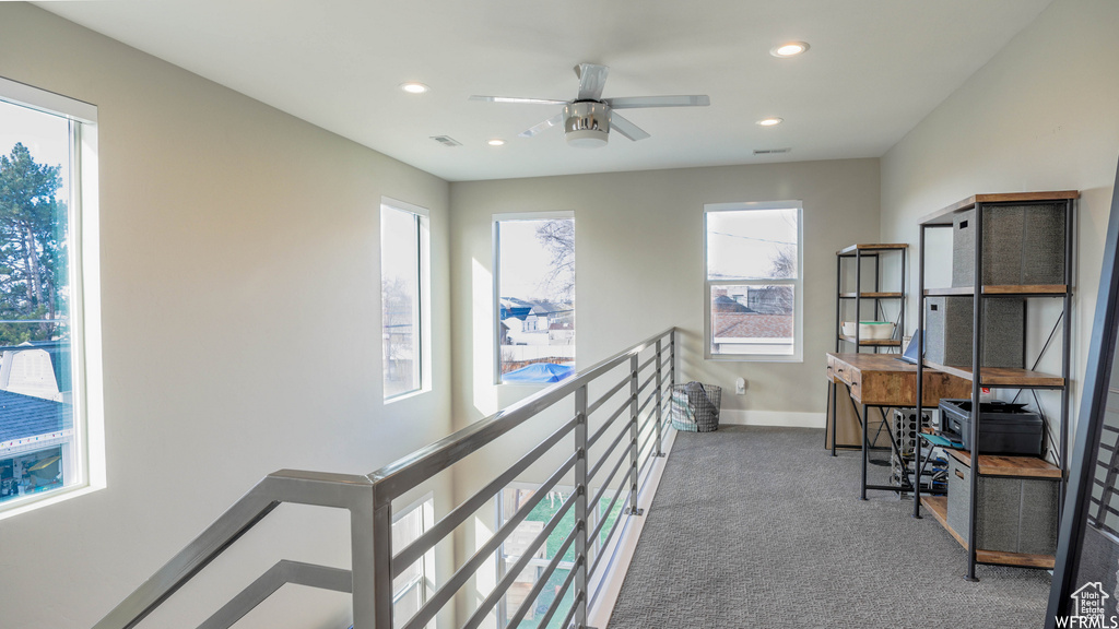 Hallway featuring carpet floors