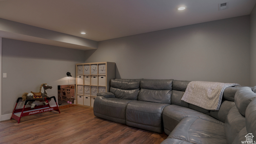 Living room with hardwood / wood-style flooring