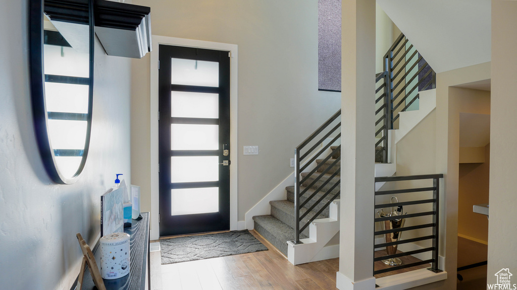 Foyer entrance featuring hardwood / wood-style floors