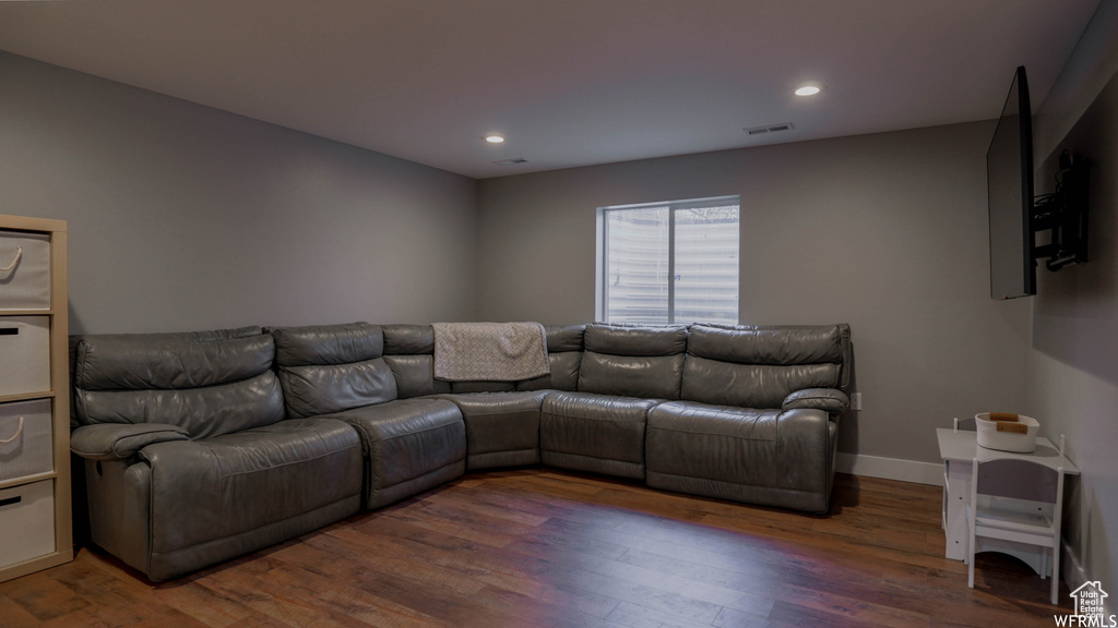 Living room featuring dark hardwood / wood-style flooring