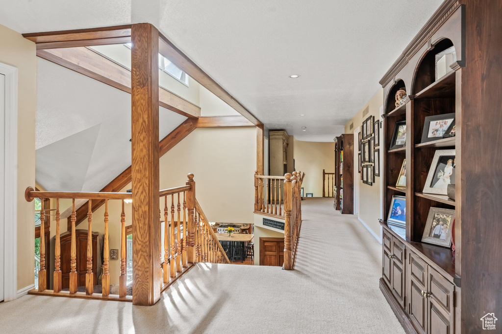 Hallway featuring carpet