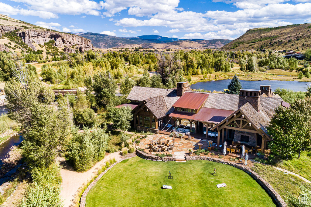 Aerial view featuring a water and mountain view