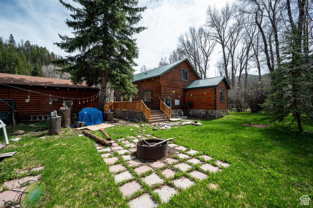 View of yard featuring a fire pit