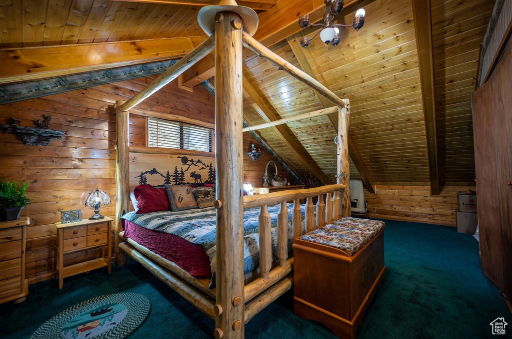 Carpeted bedroom featuring wooden ceiling, vaulted ceiling with beams, and wood walls