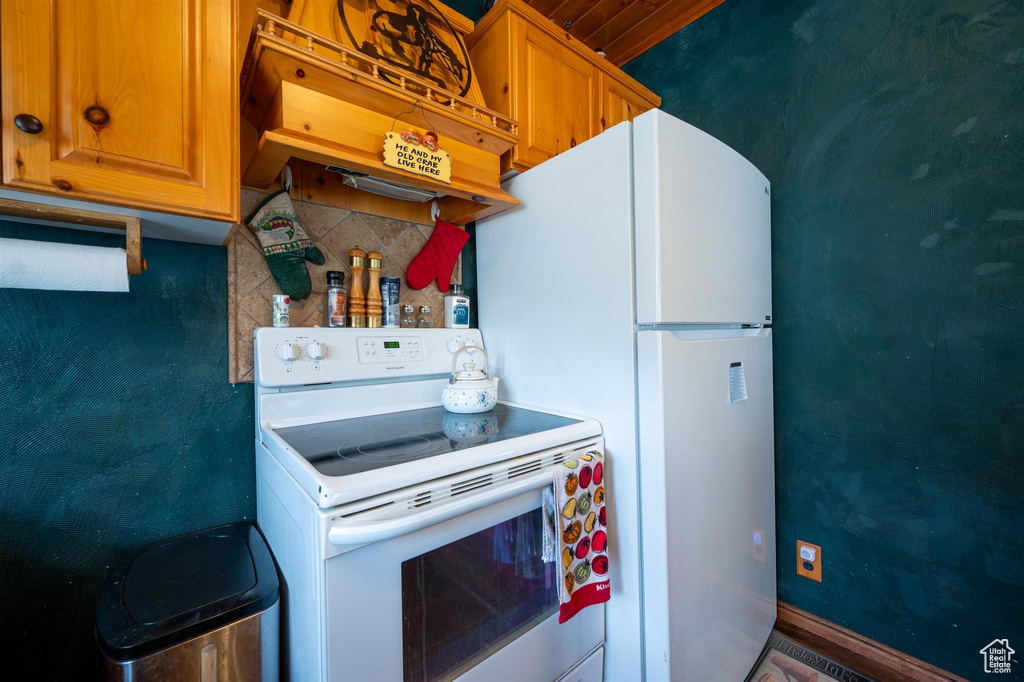 Kitchen featuring white appliances