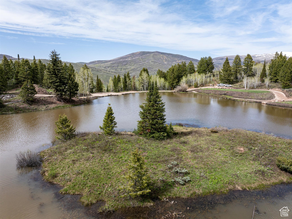 View of water feature with a mountain view