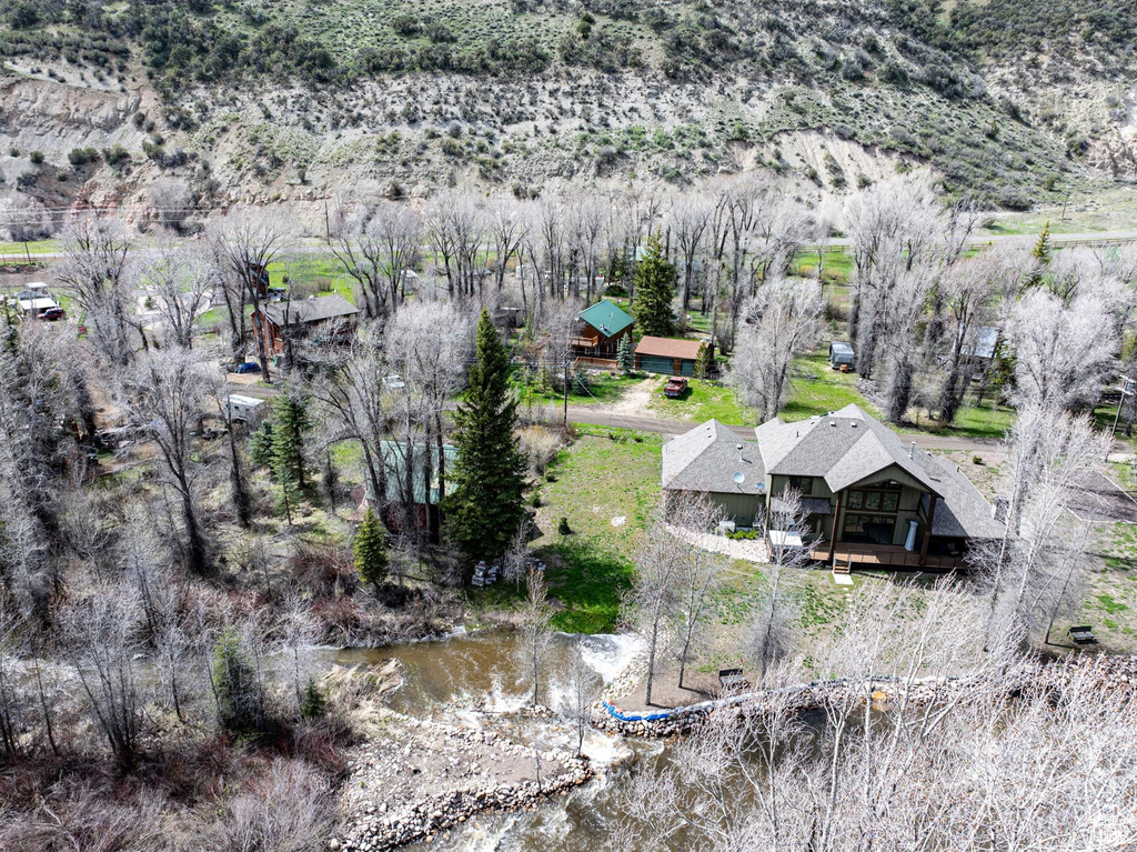 Aerial view featuring a water view