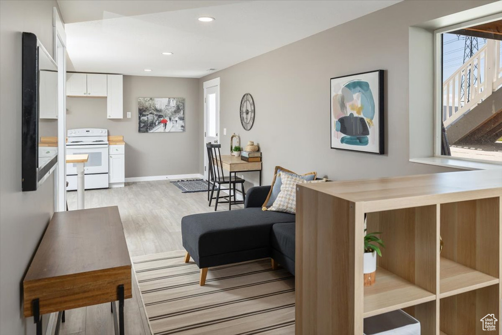 Living room with light hardwood / wood-style floors