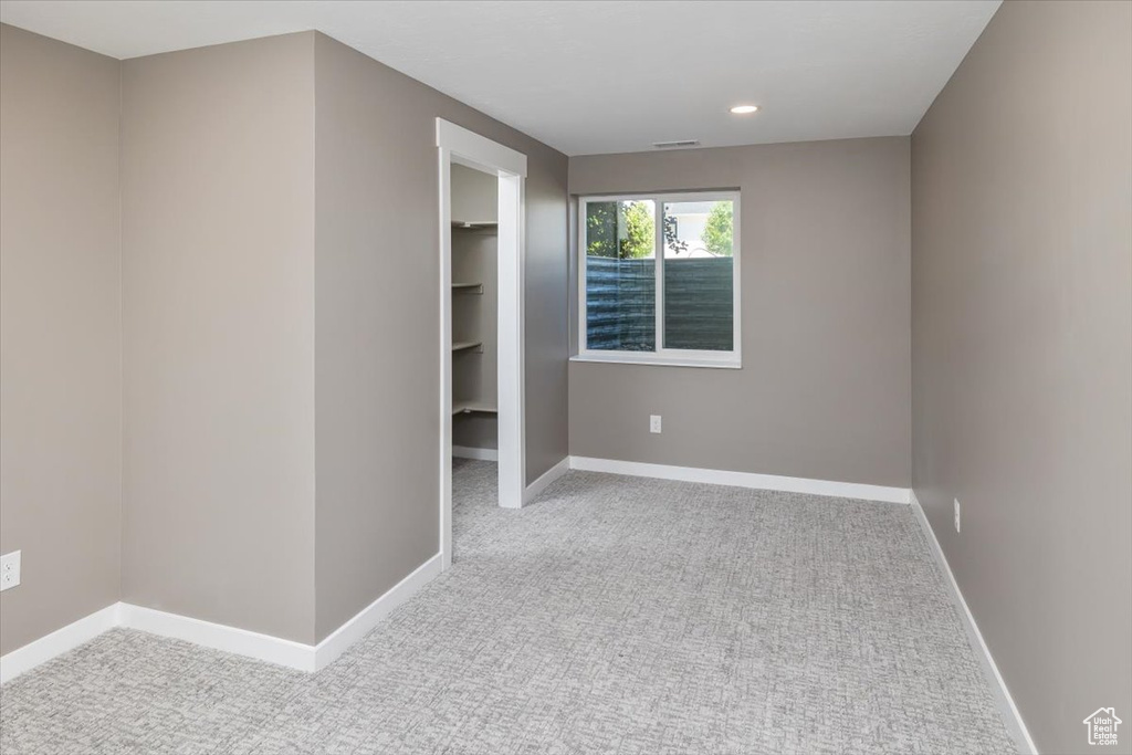 Empty room with carpet flooring