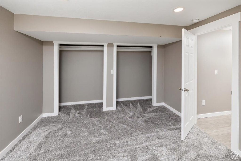 Basement featuring carpet