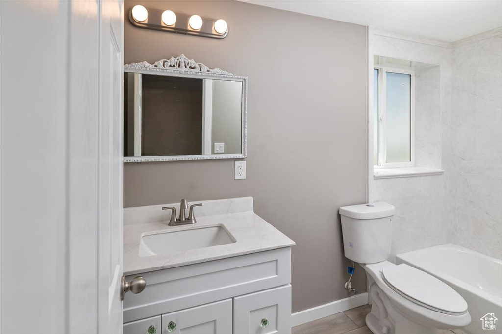 Full bathroom featuring tile flooring, bathing tub / shower combination, vanity, and toilet