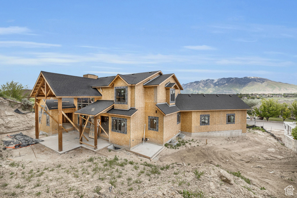 Rear view of property with a patio area and a mountain view