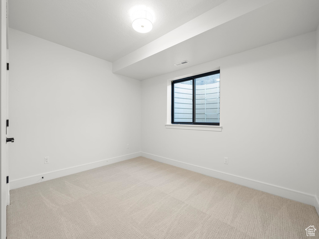 View of carpeted spare room