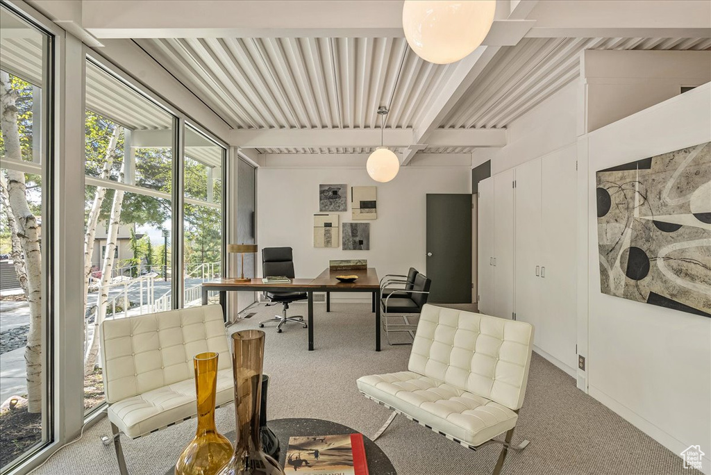 Carpeted office with beam ceiling