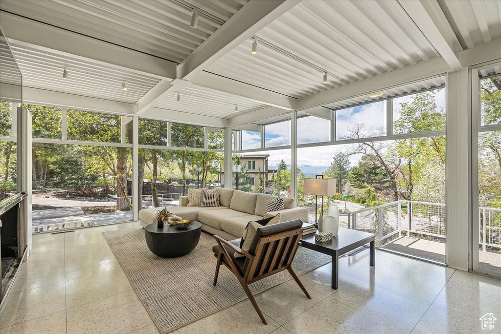 Sunroom / solarium with beamed ceiling