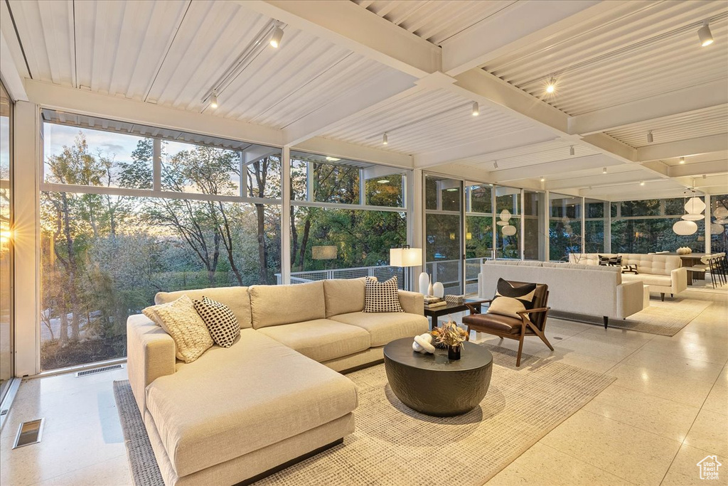 Sunroom / solarium with beamed ceiling