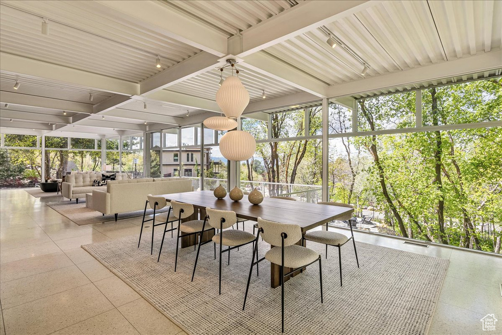 Sunroom / solarium with beamed ceiling