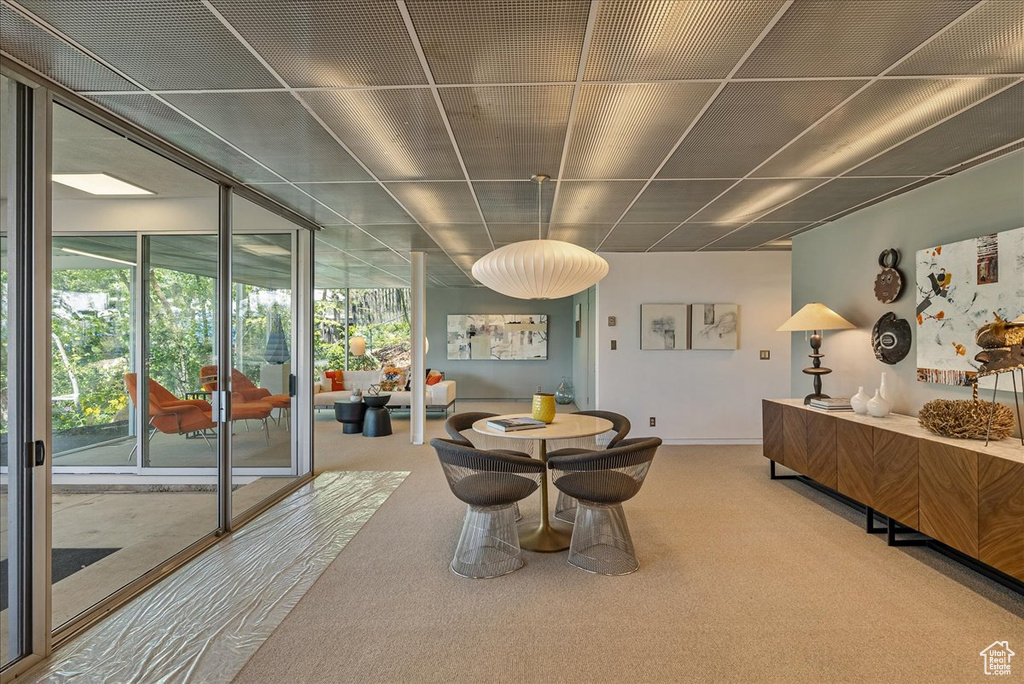 Dining area with carpet and plenty of natural light