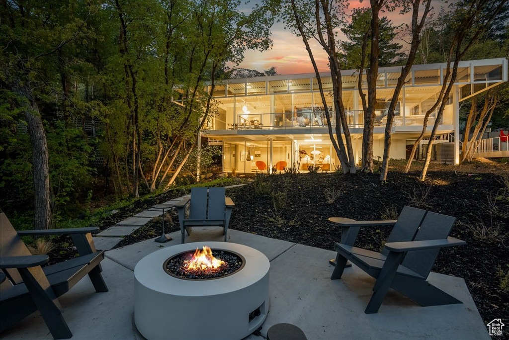 Patio terrace at dusk with an outdoor fire pit