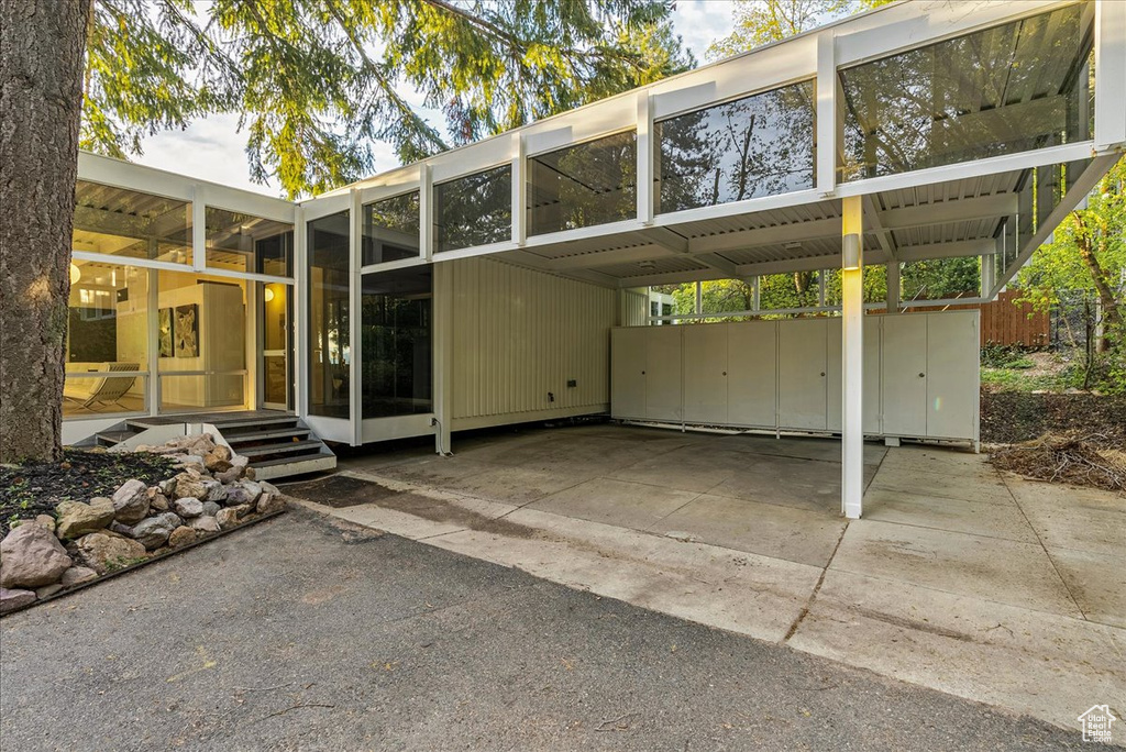 Exterior space featuring a carport