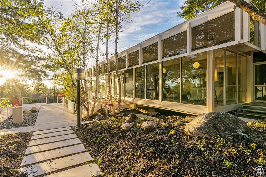 Back of property featuring a sunroom