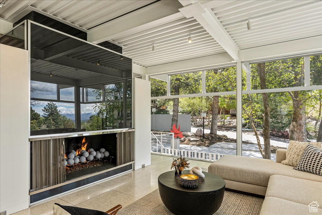 Sunroom with beam ceiling