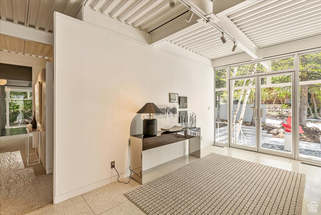 Interior space featuring beam ceiling