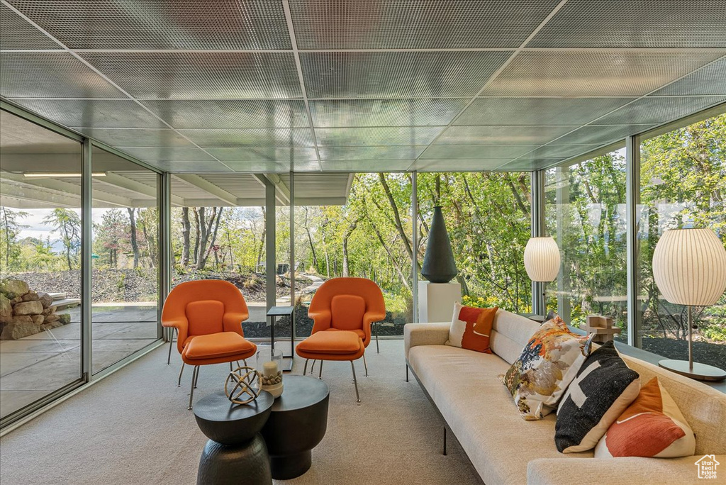 Sunroom / solarium featuring a healthy amount of sunlight