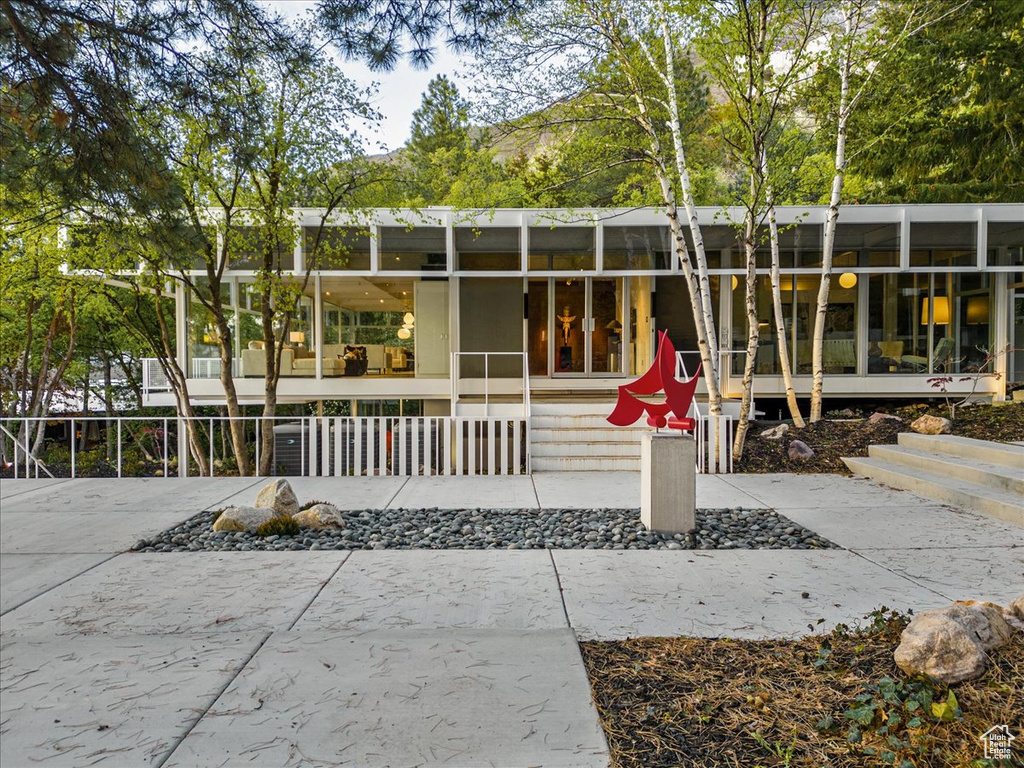 View of front facade with a patio area