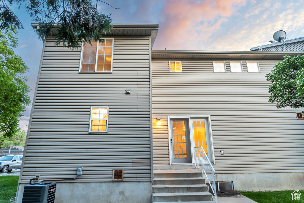 Back house at dusk with central AC