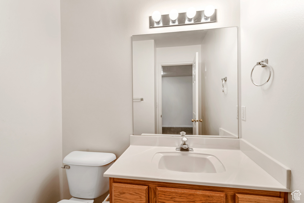 Bathroom featuring vanity and toilet