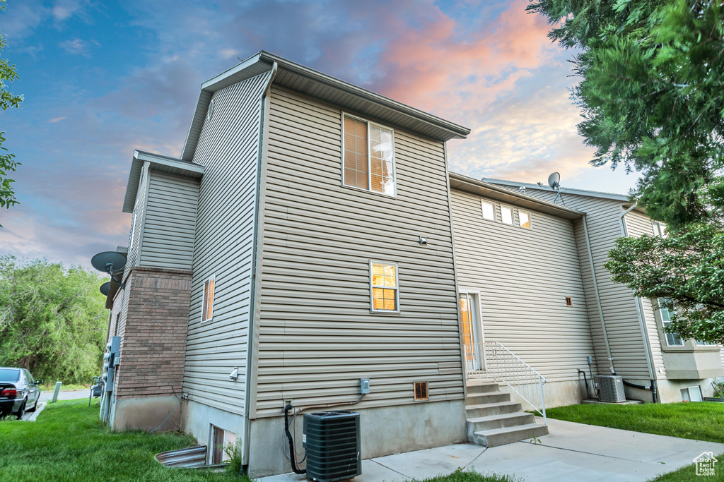 Back house at dusk with central AC