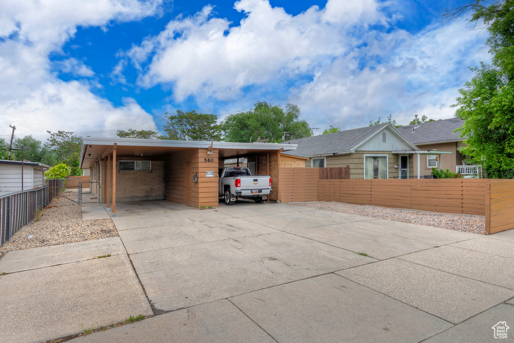 View of front of house with a carport