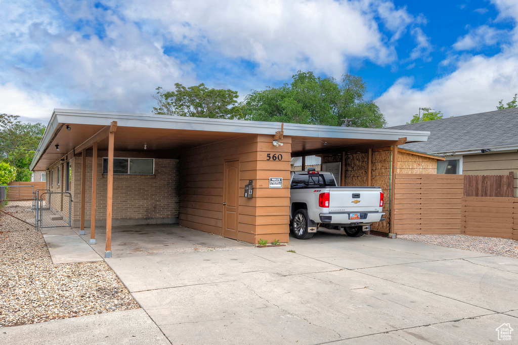 Exterior space featuring a carport