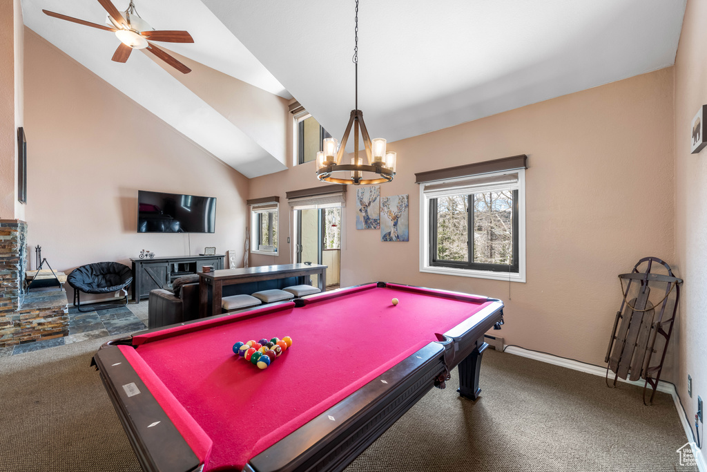 Rec room featuring high vaulted ceiling, carpet, billiards, and ceiling fan with notable chandelier