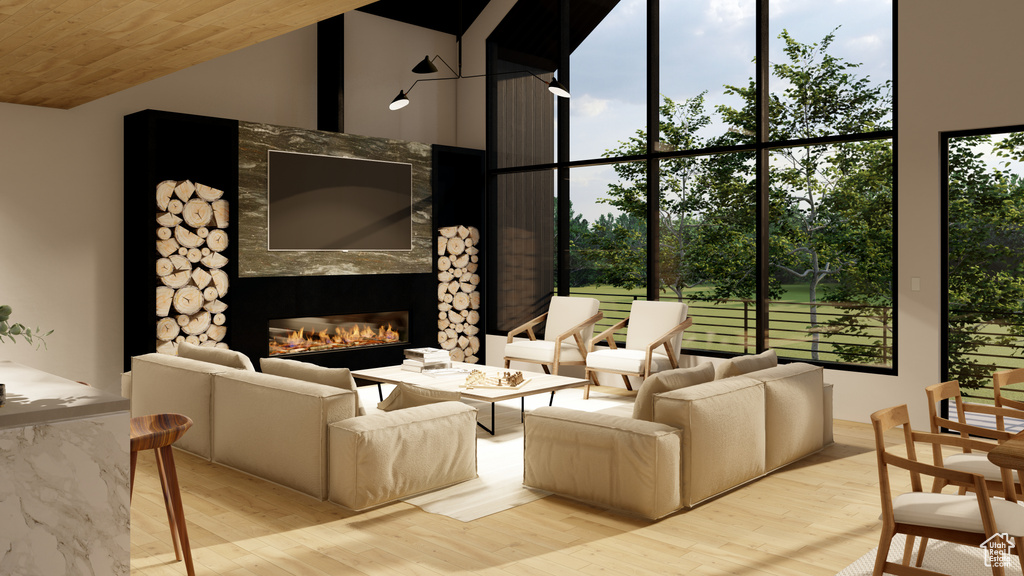 Living room with a large fireplace, a high ceiling, light hardwood / wood-style floors, and wood ceiling