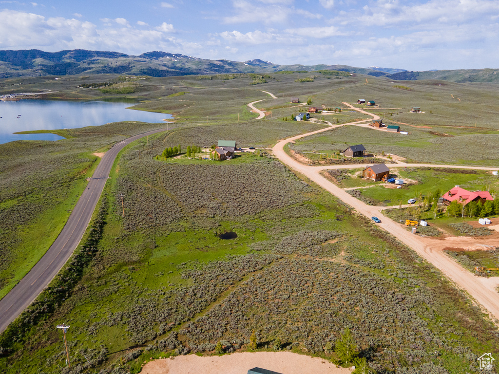 Bird's eye view with a water and mountain view and a rural view