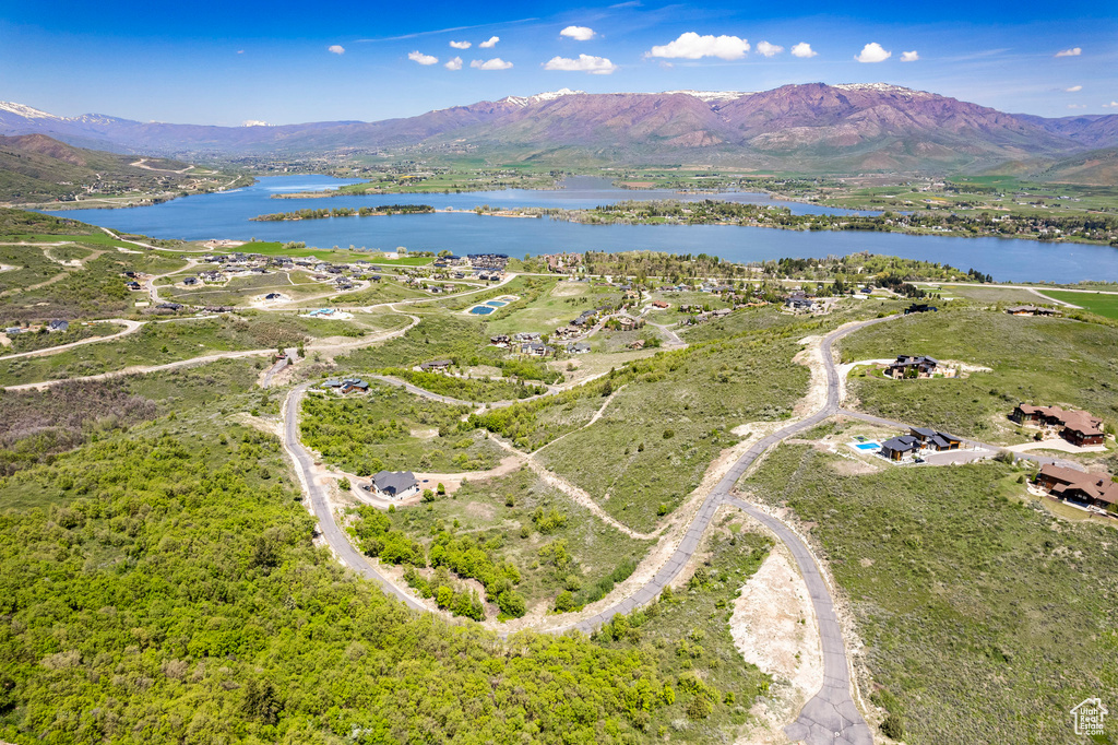 Aerial view featuring a water and mountain view