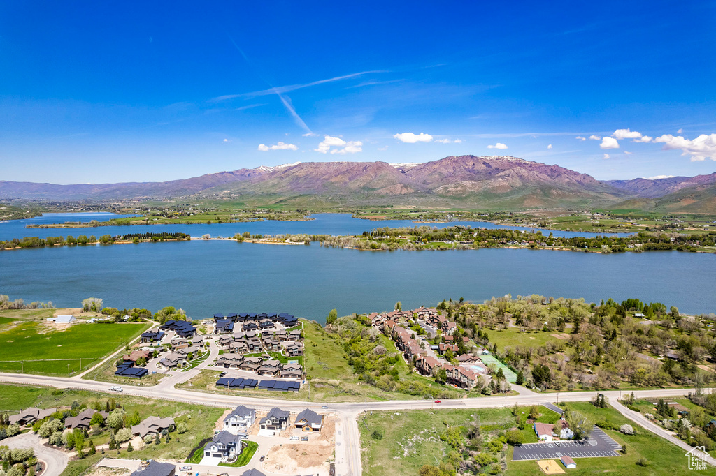 Drone / aerial view with a water and mountain view