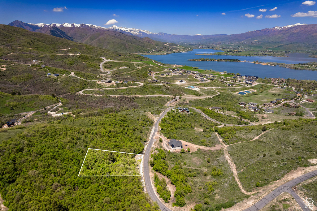 Aerial view featuring a water and mountain view