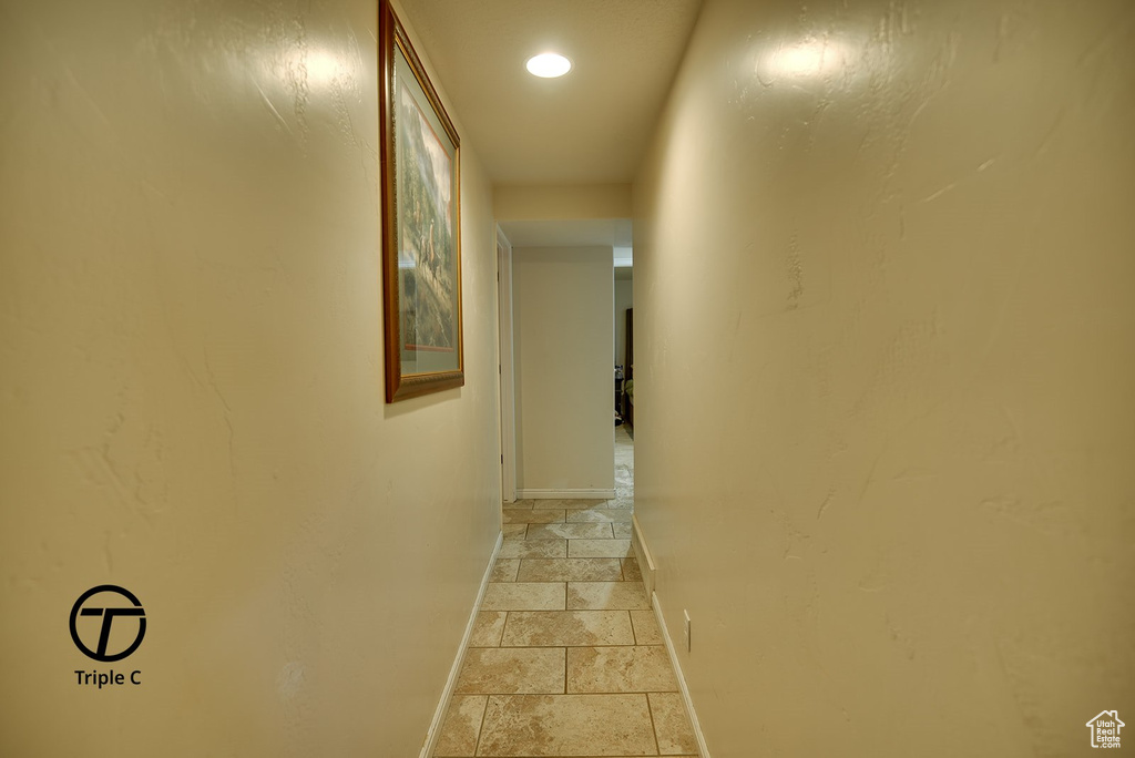 Hall with light tile floors