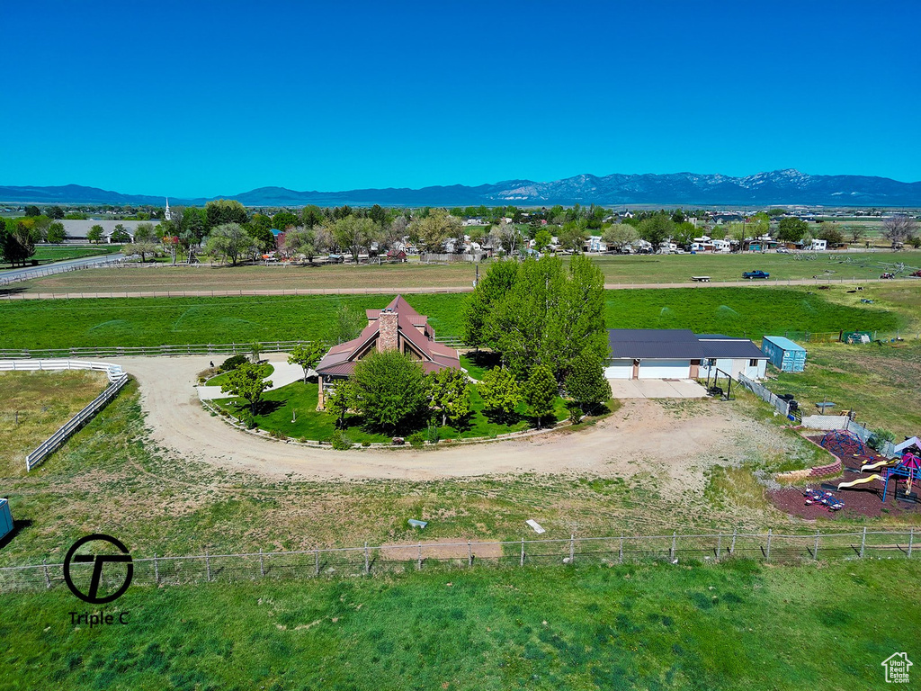 Drone / aerial view with a mountain view and a rural view