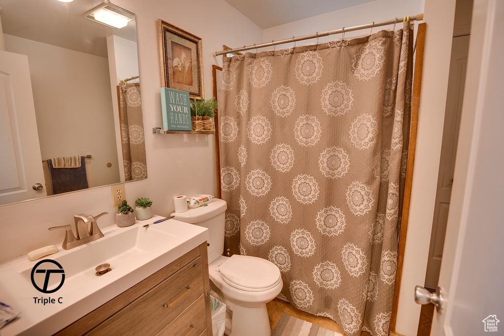 Bathroom featuring vanity and toilet