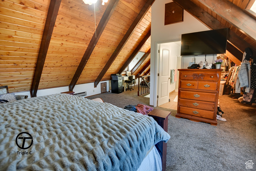 Bedroom with vaulted ceiling with beams, carpet floors, and wood ceiling